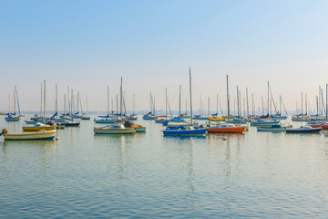 Boats anchored in a calm, peaceful harbour