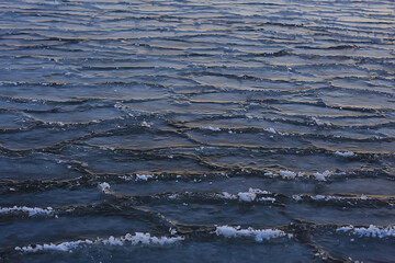 freezing sea ice round pieces, ocean background winter climate coast