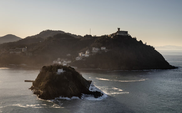 Santa Clara Island and Mount Igueldo in San Sebastian Donostia. View from Mount Urgull at sunset.