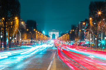 Fototapeta na wymiar Champ élysées avenue view during twilight, long exposure image with light trails.
