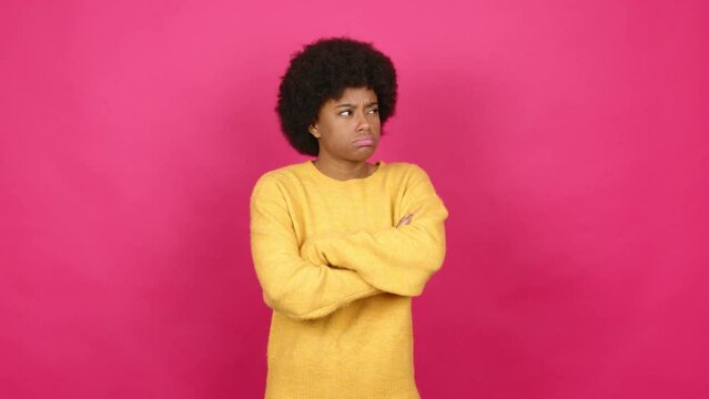 Young African American woman having doubts and questioning an idea over isolated background