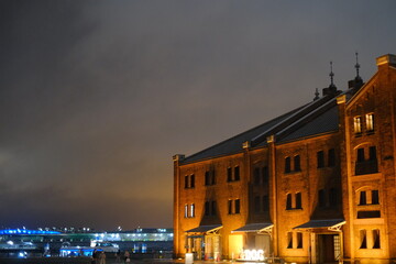 Fototapeta na wymiar Old building with orange glowing brick figure chestnut