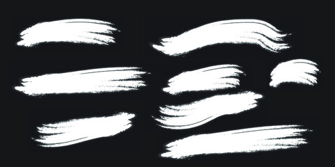 set of white grunge brush strokes vector illustration isolated on black background.