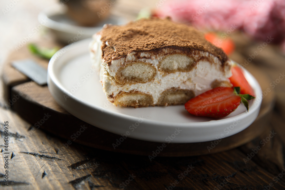 Poster traditional homemade tiramisu on a plate