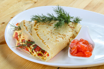 Pancake with salmon fiilet and cheese