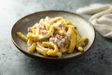 Traditional homemade pasta Carbonara with cheese and ham