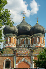 Black domed red brick building of the Cathedral of the Intercession of the Most Holy Theotokos built in 1671 on Izmailovo Island near the residence of the House of Romanov in Moscow, Russia