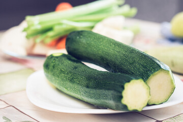 Green vegetables on a white plate (zucchini)