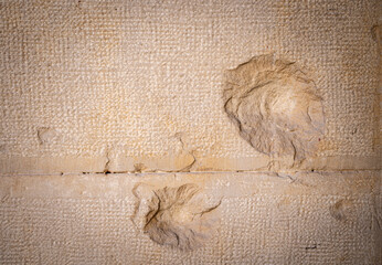 Real bullet and shrapnel holes from the Spanish civil war in a stone wall