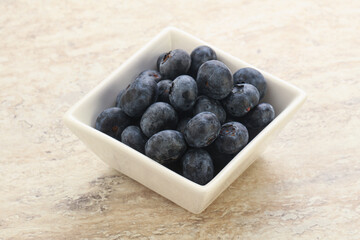 Sweet ripe blueberry heap in the bowl