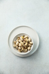 Organic pistachio in a white bowl