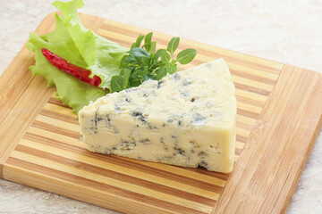 Blue cheese piece over board