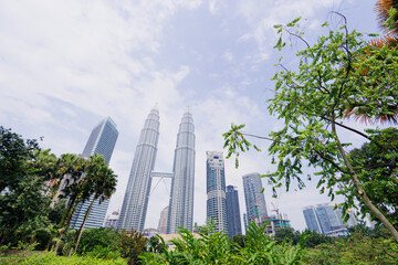 Kuala Lumpur, Malaysia - The Petronas Twin Towers against blue sky, The world's tallest Twin Towers. - obrazy, fototapety, plakaty