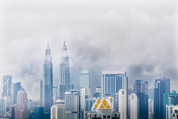 Fototapeta na wymiar Cityscape with cloudy sky and scyscrapers. Megapolis Kuala-Lumpur, Malaysia. 