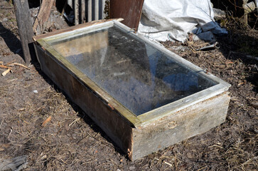 Insulated bed, greenhouse of old window frames.