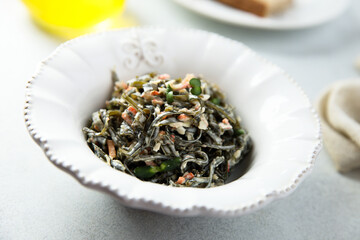 Seaweed salad with vegetables and herbs