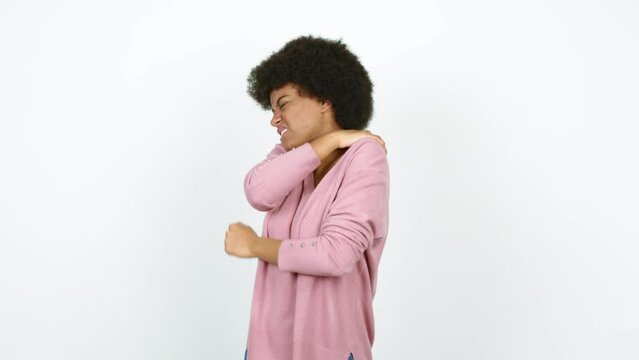 Young African American woman with shoulder pain over isolated background