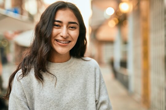 Young middle east girl smiling happy standing at the city.