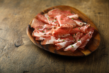 Delicious sliced smoked ham on a desk