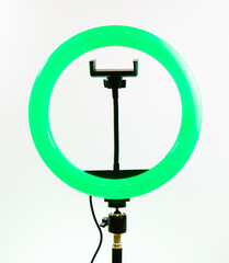 Ring lamp with a smartphone holder. Green light.