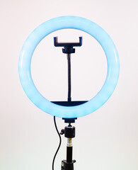 Ring lamp with a smartphone holder. Blue light.