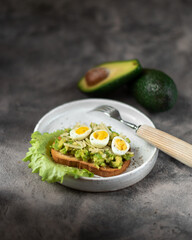 sandwich with avocado and quail eggs