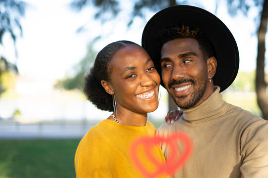 Afro couple in love hugging and enjoying the day together, valentine day concept