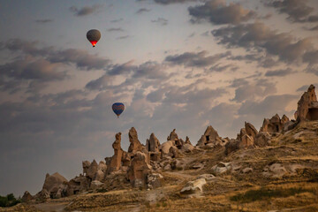 Cappadocia, Turkey – November 2020. an early morning take-off of a hot air balloon over idyllic Cappadocia
