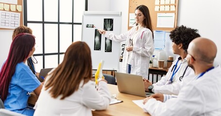 Obraz premium Group of young doctor discussing in a medical meeting at the clinic office.