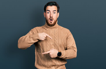 Young hispanic man wearing casual clothes in hurry pointing to watch time, impatience, upset and...