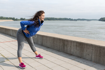 Young active sporty business woman morning routine of stretching and running exercising outdoor before she go to the work at office. Self loved female fitness workout training for healthy life.