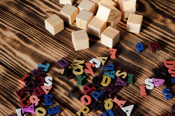 Multicolored letters of the alphabet. Volumetric multicolored letters. The alphabet is in a chaotic state. Letters as a symbol of reading. Reading English literature. 