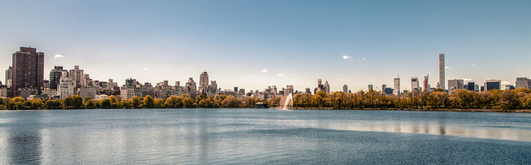 Fototapeta na wymiar Postcard from New York - Amazing view of New York City skyline from Central park lake