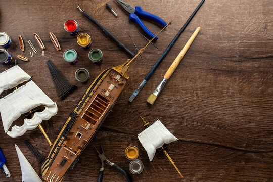 Top view Model Ship Building handcraft on table with different materials