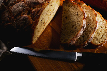 bread and knife on cutting board