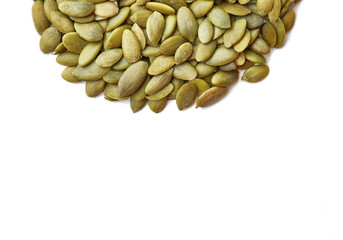 Organic pumpkin seeds isolated on a white background. Closeup, top shot, copy space