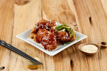 Deep Fried Crispy Chicken with Garlic Sauce in Korean Style or Dakgangjeong