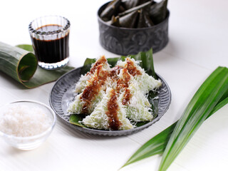 Lupis or Lopis) is an Indonesian Traditional Sweet Cake Made of Glutinous Rice. Lupis is a Typical Indonesian Food, Especially in Java. There are Two Common forms of Lupis, Triangle and Round