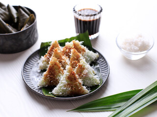 Lupis or Lopis is an Indonesian Traditional Sweet Cake Made of Glutinous Rice. Lupis is a Typical Indonesian Food, Especially in Java. There are Two Common forms of Lupis, Triangle and Round