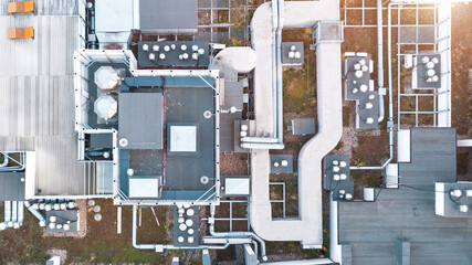 Ventilation air conditioning system on the roof of the building. Industrial ventilation and air conditioning system. Multi-storey building, view from above