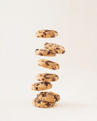 Chocolate chip cookies on the cream background. Sweet food biscuit concept. - obrazy, fototapety, plakaty