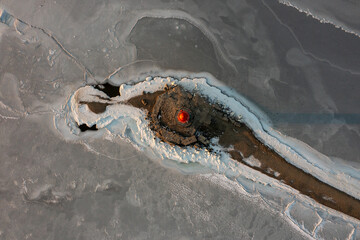 Sea Lighthouse on the Tokarevskaya Koshka rock spit, in winter.