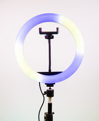 Ring lamp shines in two colors. Blue and yellow.