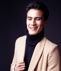 handsome asian fashion looking man posing in studio on black background, lifestyle modern people concept