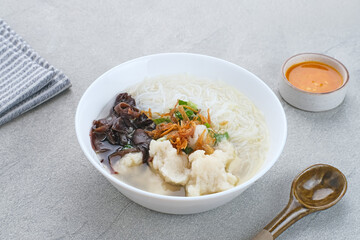 Tekwan, traditional food from Palembang, Indonesia. Made from a mixture of fish meat and tapioca, which is shaped into small balls, with vermicelli, mushrooms, spring onions, celery. Selected focus.

