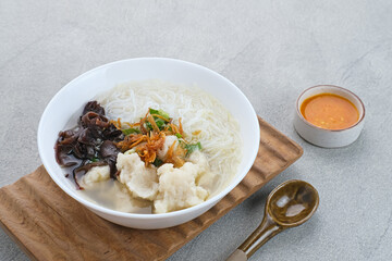 Tekwan, traditional food from Palembang, Indonesia. Made from a mixture of fish meat and tapioca, which is shaped into small balls, with vermicelli, mushrooms, spring onions, celery. Selected focus.
