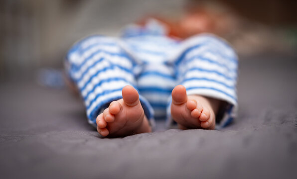 Feet of baby newborn is sleeping. Close up. Stock photo