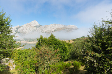 Views of the riaño reservoir and its mountains with the morning mists, in Leon (Spain) from the path to Gilbo peak