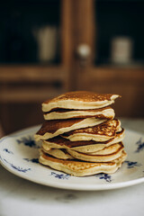 Stack of pancakes on a plate close-up. dry Pancakes without any syrup or jam	
