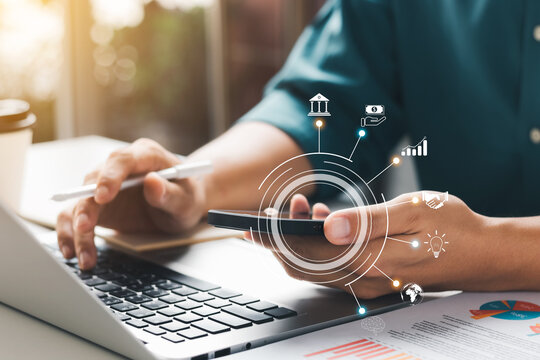 Businessman working on company financial report balance analysis. With virtual reality graphics in the office, concepts economic marketing and strategy.